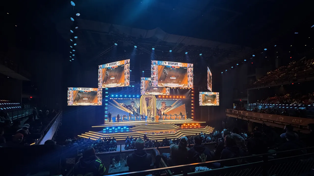 A lit esports stage with large screens at the 2025 Rainbow Six Siege Invitational